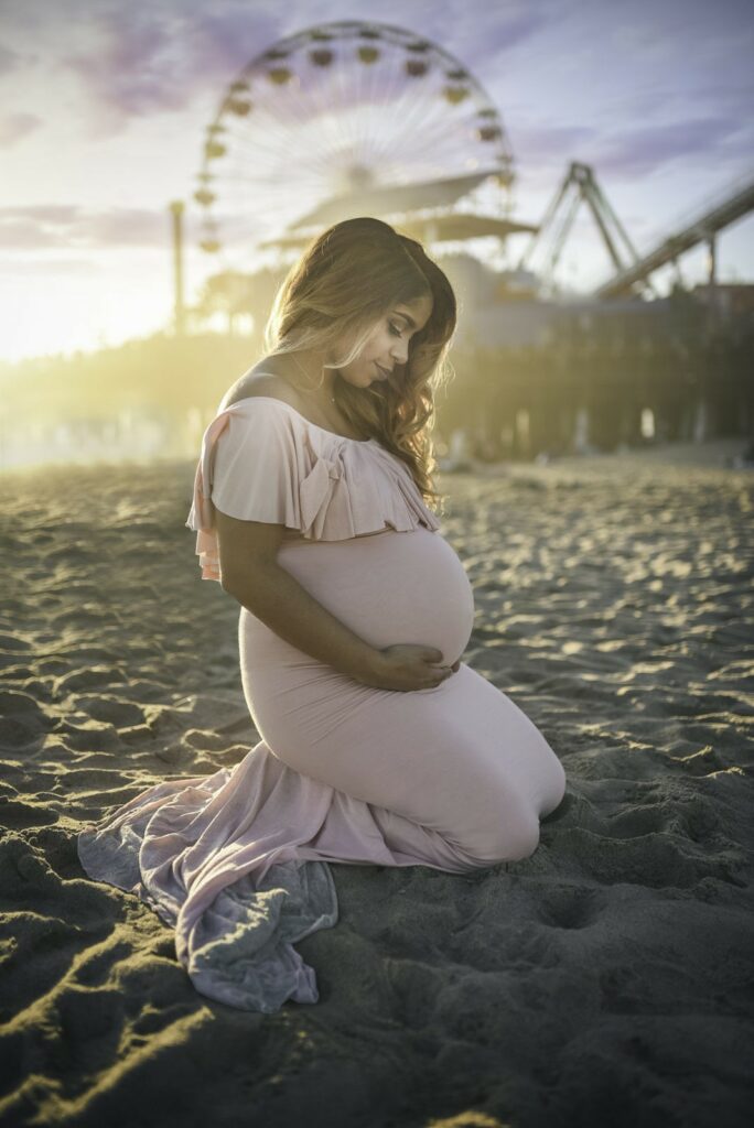 Beautiful Belly Session at the Santa Monica Pier as photographed by Los Angeles birth photographer Diana Hinek for Dear Birth