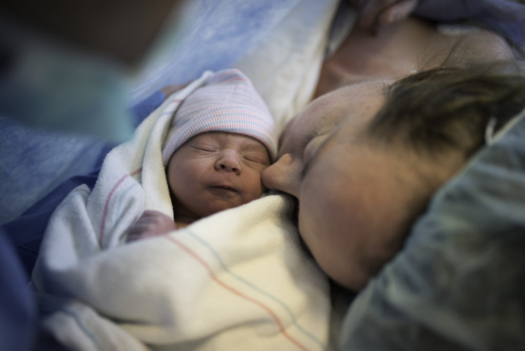 Color image of  mother and baby after a cesarean birth. Image by Los Angeles birth photographer Diana Hinek for #dearbirth during Cesarean awareness month