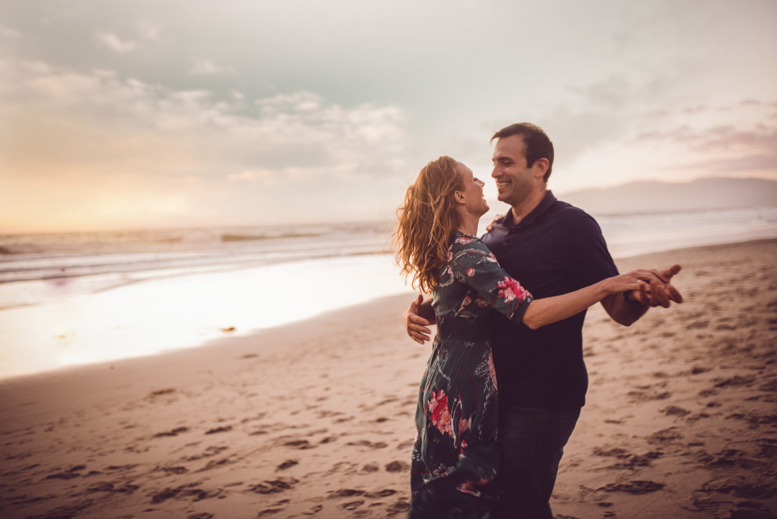 Color image of couple dancing at the beach as photographed by Black and white image of Grandparents with all the grandchildren photographed by Los Angeles Family photographer and videographer Diana Hinek for Dear Birth