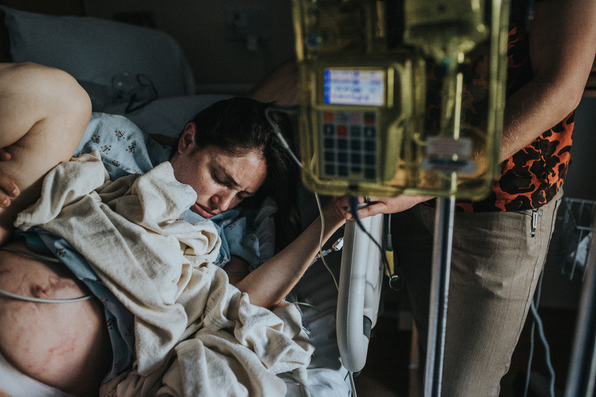 Color image of woman pushing her baby during her gentel vbac at UCLA Santa Monica as captured by Los Angeles birth photographer and videographer Diana Hinek for Dear Birth