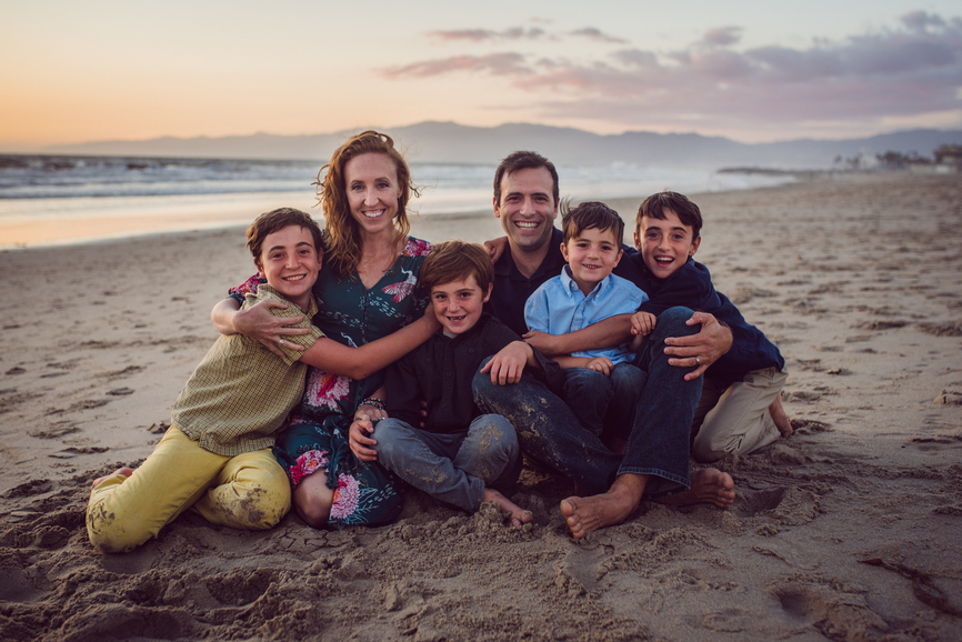 color image of family of 6 posing at the beach as photographed by Black and white image of Grandparents with all the grandchildren photographed by Los Angeles Family photographer Dear Birth