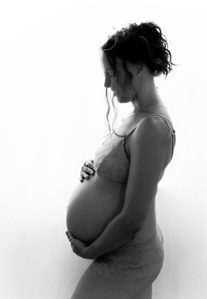 black and white silhouette of pregnant woman as photographed by Los Angeles maternity and birth photographer Diana Hinek for Dear Birth as part of the blog post baby makes 4