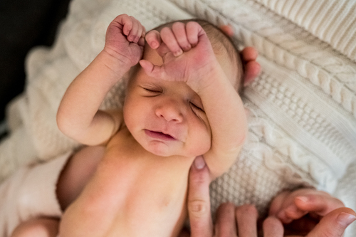Newborn baby in blog post: The Rules about Birth Due Dates by Los Angeles birth photographer Dear Birth